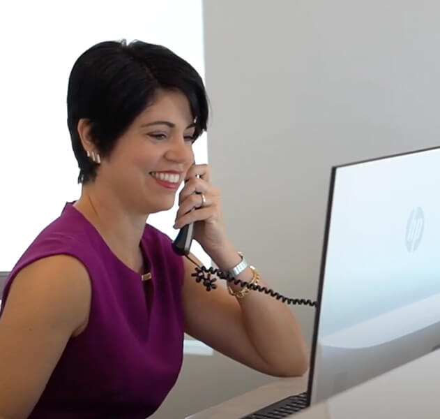 smiling woman talking on phone