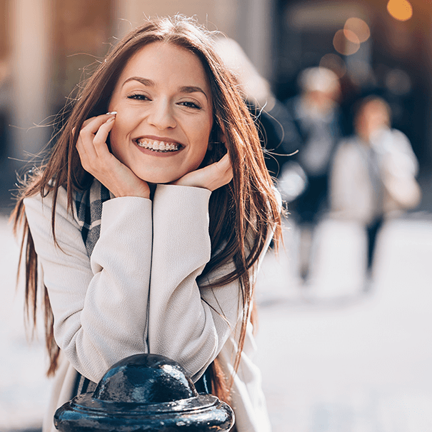 young woman with braces smiling