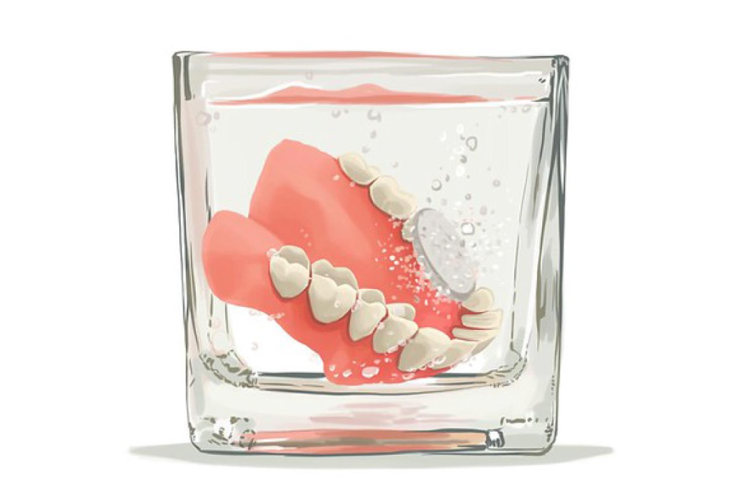 Dentures sitting in a glass getting cleaned.