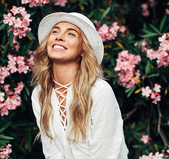 woman in front of flowers