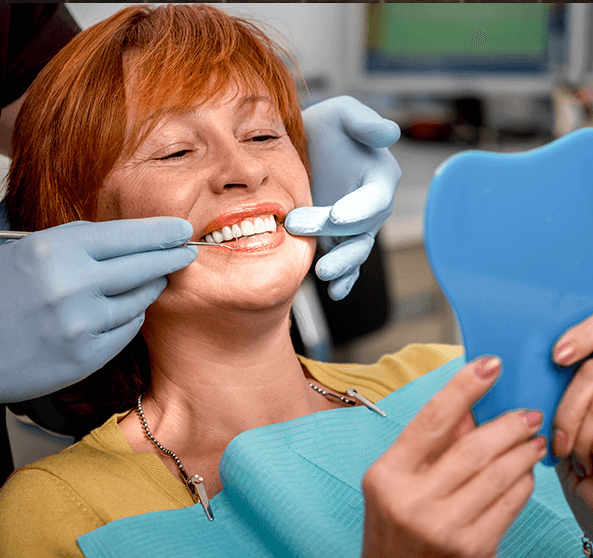 woman getting her teeth examined