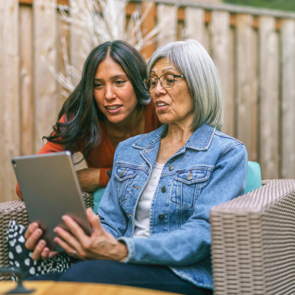 two women looking at a computer