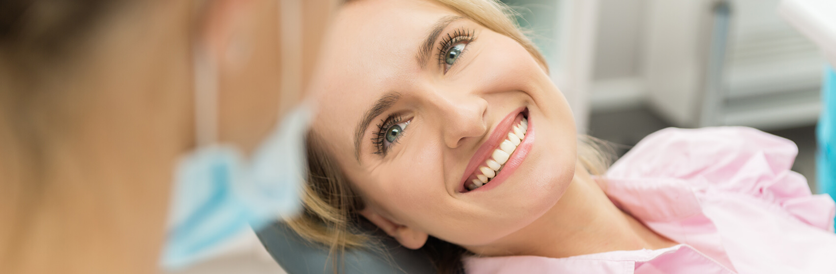 smiling woman at a dental appointment